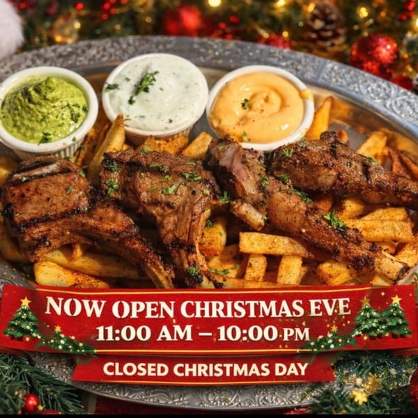 Grilled lamb chops with fries and three dipping sauces on a festive Christmas background.